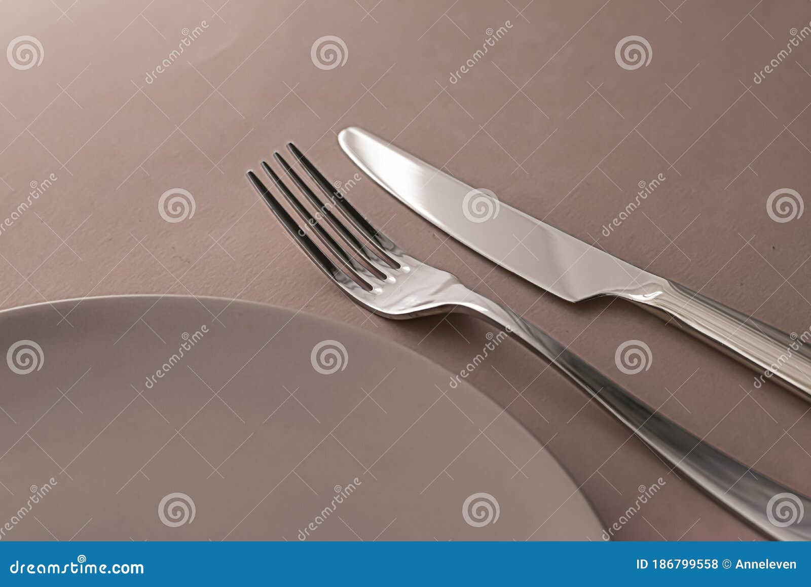Download Empty Plate And Cutlery As Mockup Set On Brown Background, Top Tableware For Chef Table Decor ...