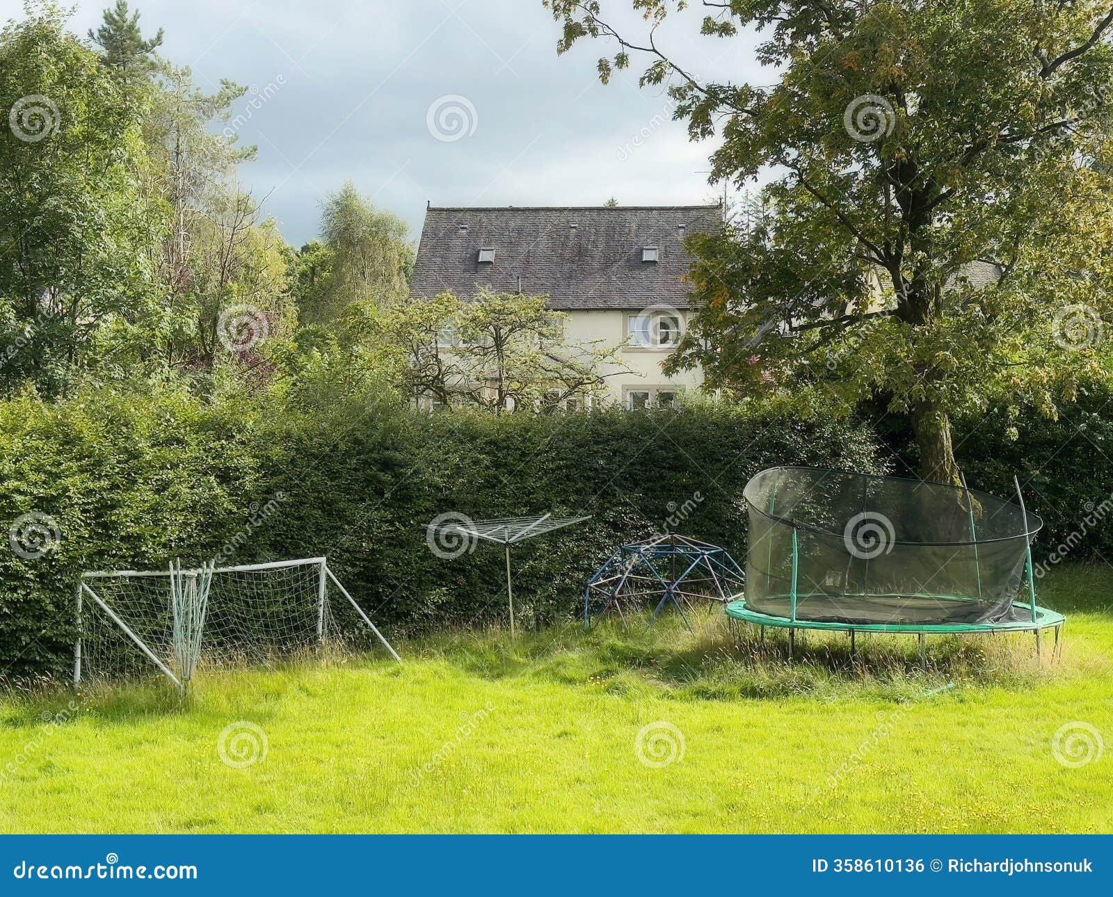 empty playground derelict swings and slide in rural area