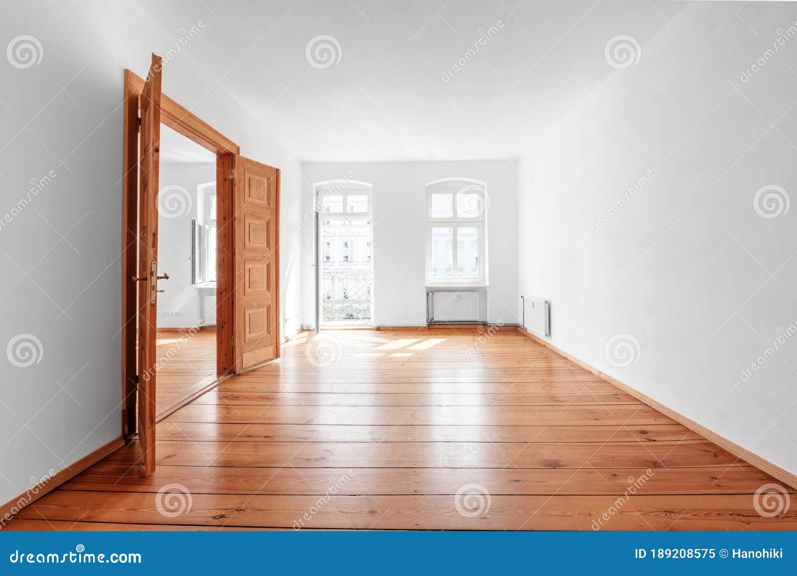 Empty Room in Renovated Flat with Wooden Floor and Balcony Stock Image