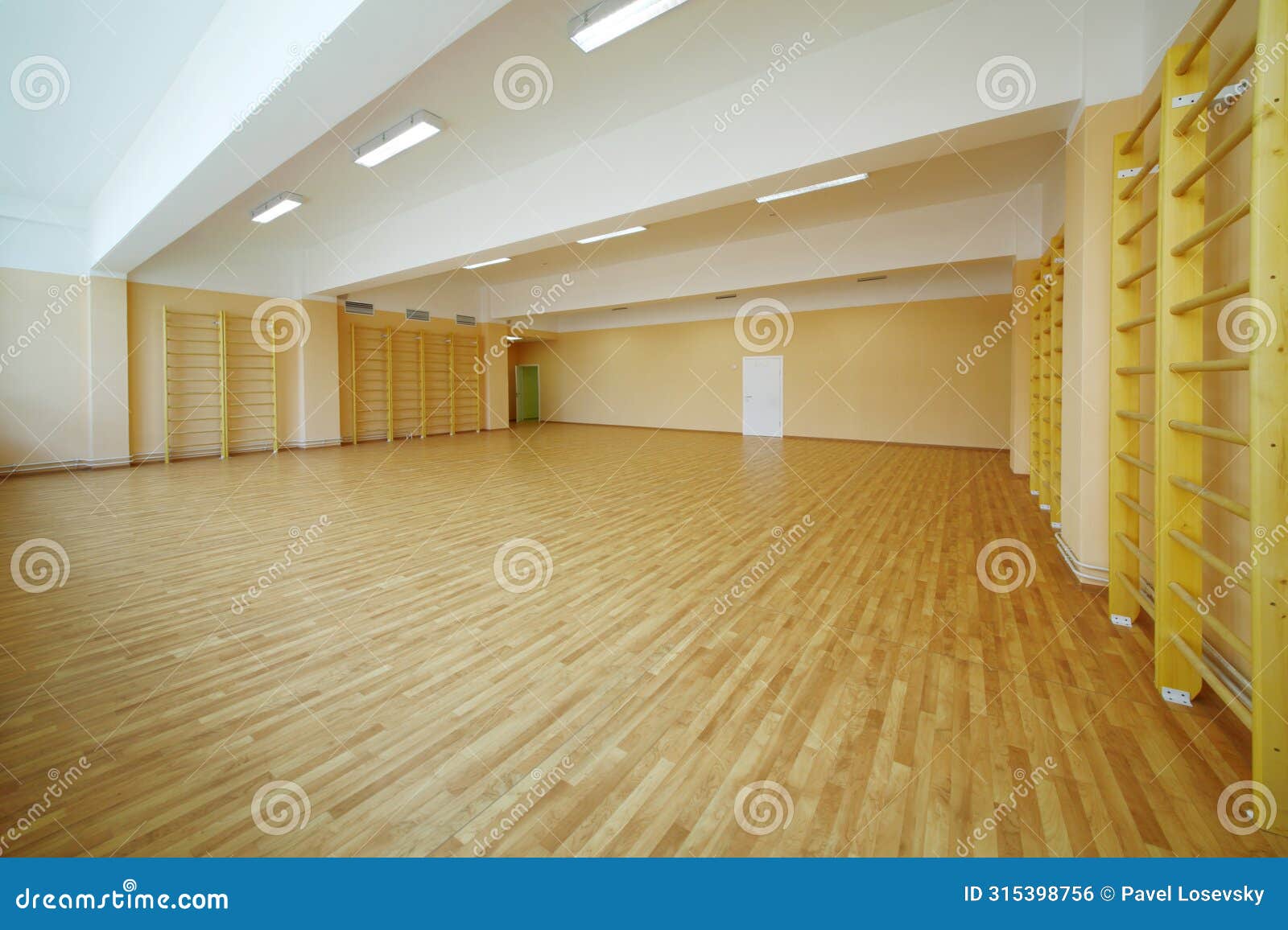 empty school gymnasium floor with yellow and