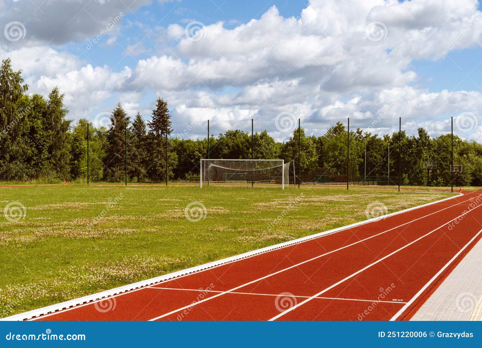 Empty School Stadium with Football Gate and Running Track Stock Photo