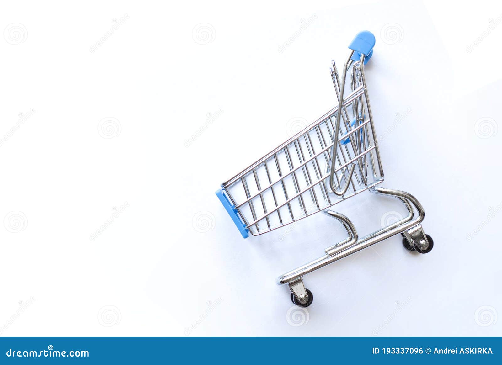 Empty Shopping Cart on Blue Background, Business Concept Stock Photo