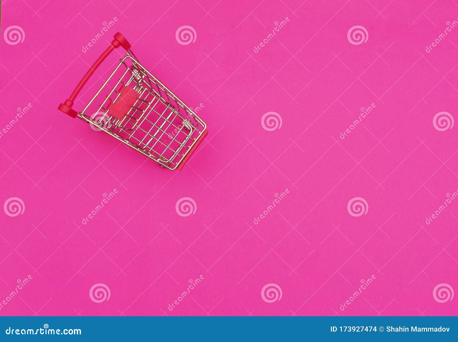Empty Shopping Cart on Pink Background. Shopping Concept Stock Photo