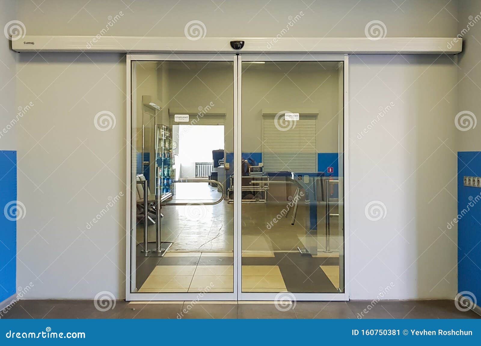 empty sliding glass front door at the airport. glass doors in the office. glass entrance. entrance to administration