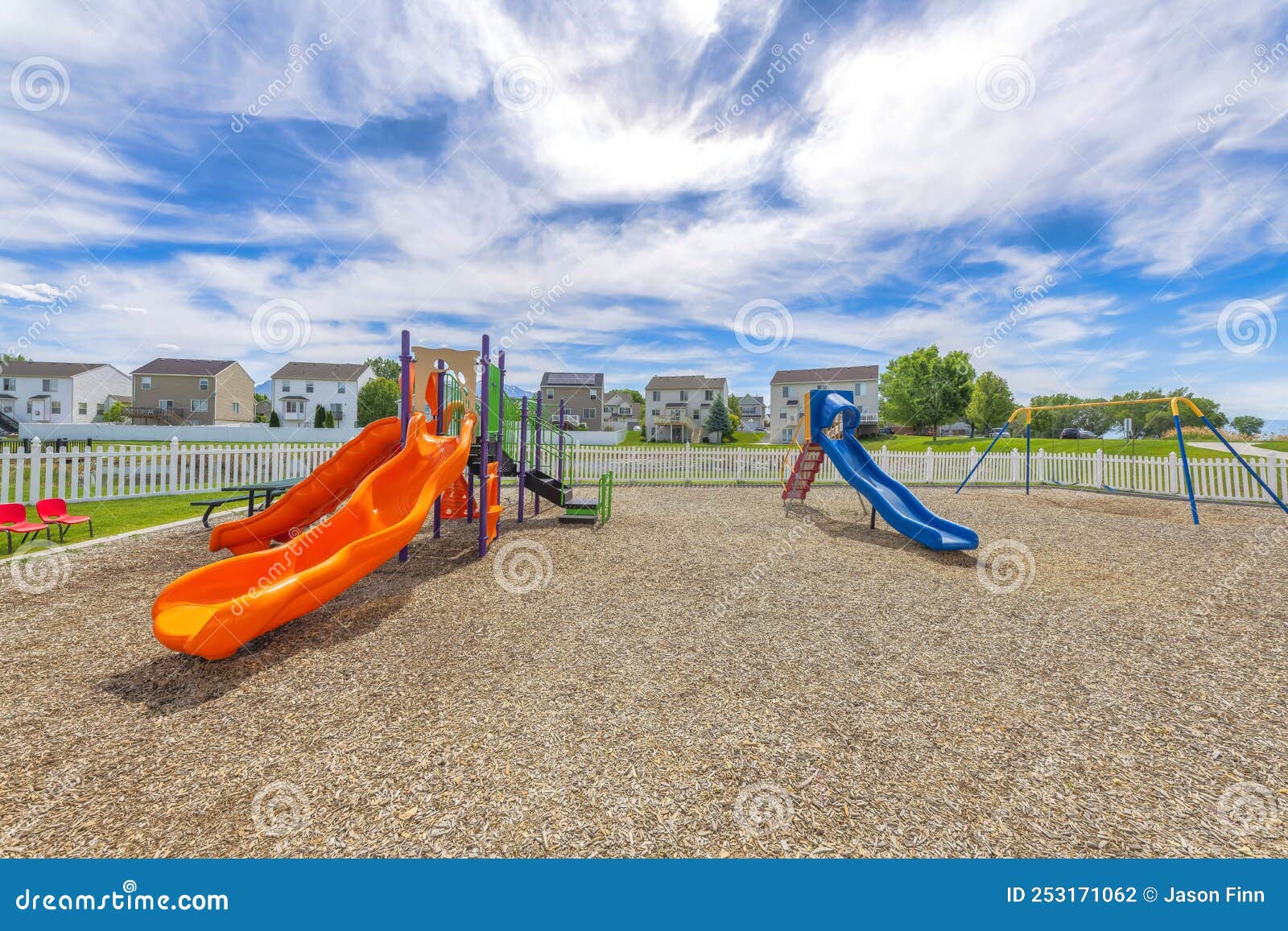 empty small playground with slides and swings near the houses at utah valley