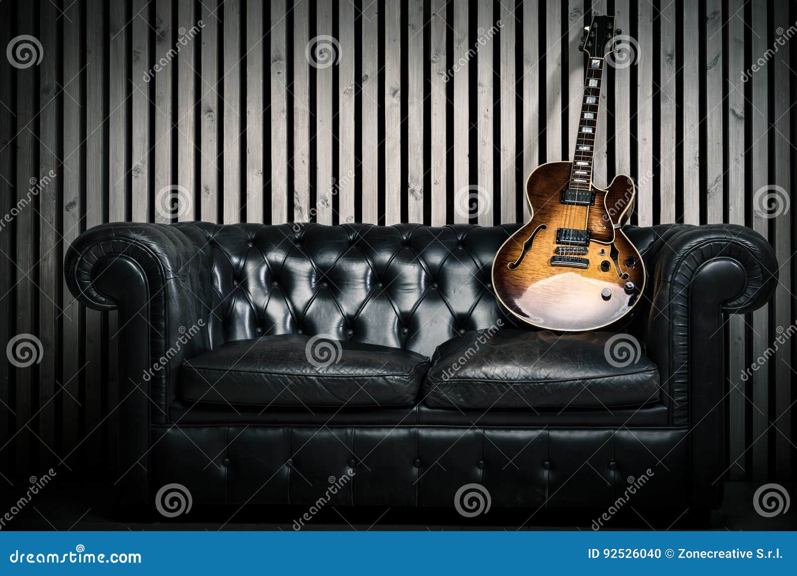 Empty Vintage Sofa And Electric Guitar With Modern Wood Wall Recording Studio Background Music Concept With Nobody Stock Photo Image Of Cool Concert 92526040