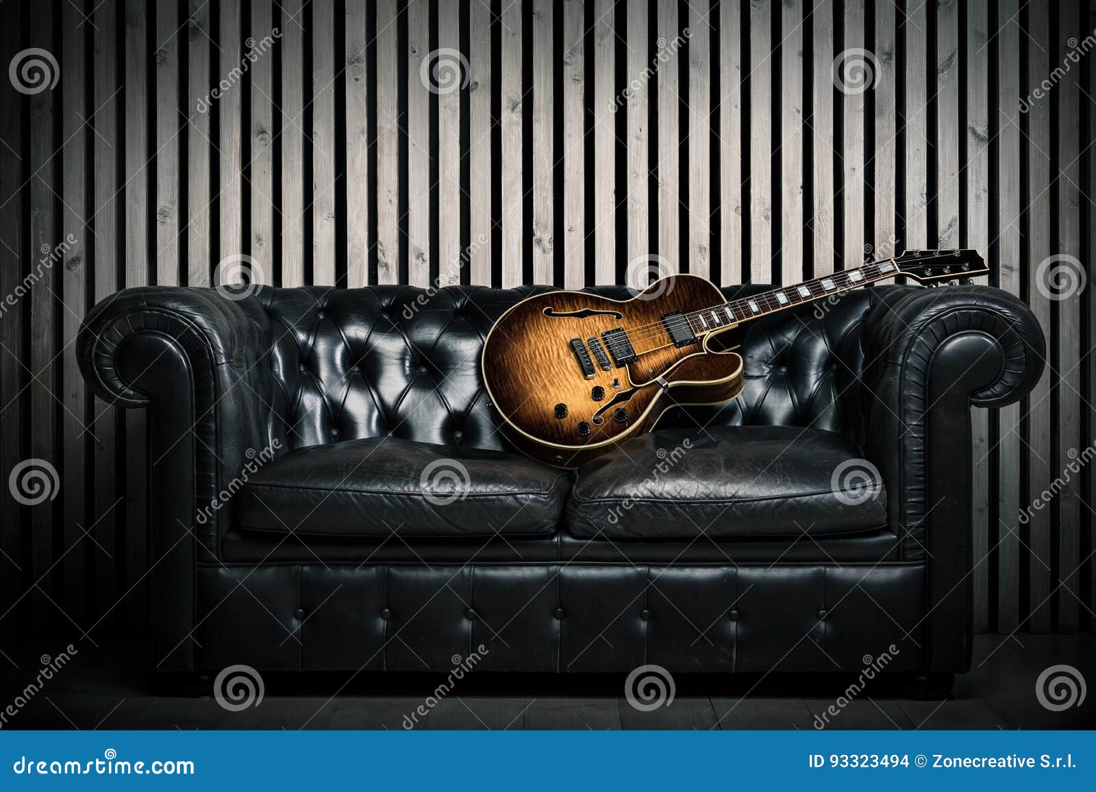Empty Vintage Sofa and Electric Guitar with Modern Wood Wall Recording  Studio Background. Music Concept with Nobody Stock Photo - Image of blues,  wall: 93323494