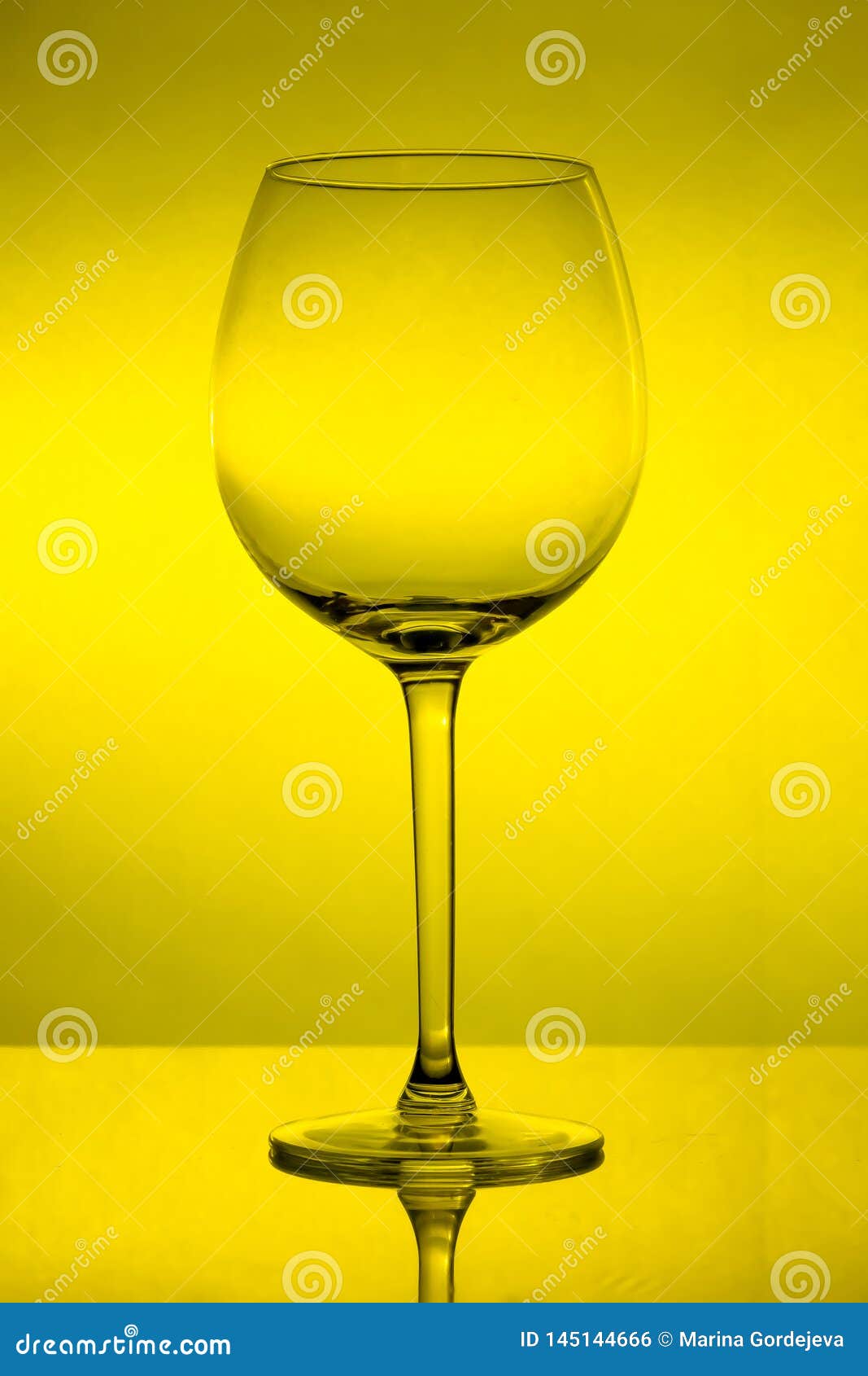 Empty Wine Glass on Yellow Background, Empty Wineglass Stock Photo