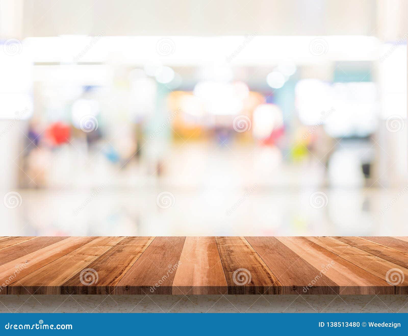 empty wood table top with blur department store boekh background,mock up template for display or montage of product or content use