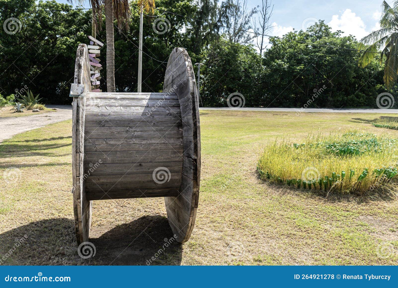 Empty Wooden Cable Coil or Spool for Cable or Rope Standing on the Side