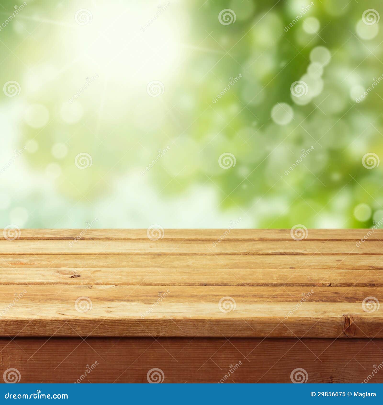 empty wooden deck table with foliage bokeh