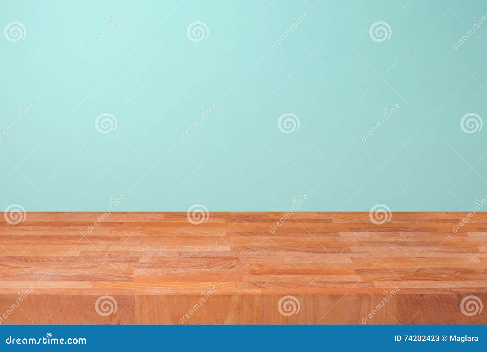 empty wooden kitchen counter over mint wall background for product montage