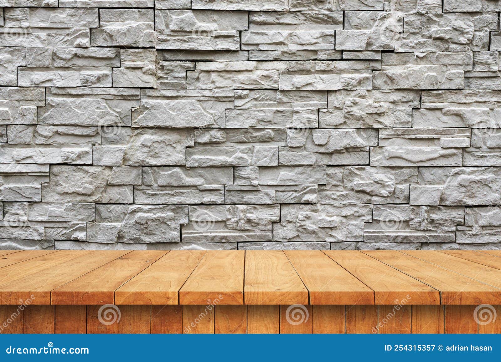 empty wooden table and old brick wall background