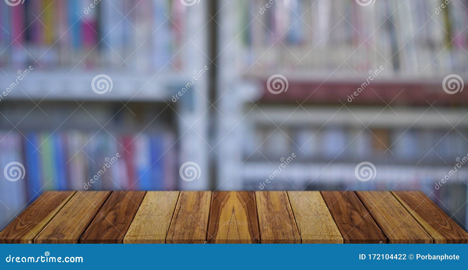 Empty Wooden Table Over Blurred Bookshelf Background Stock Photo