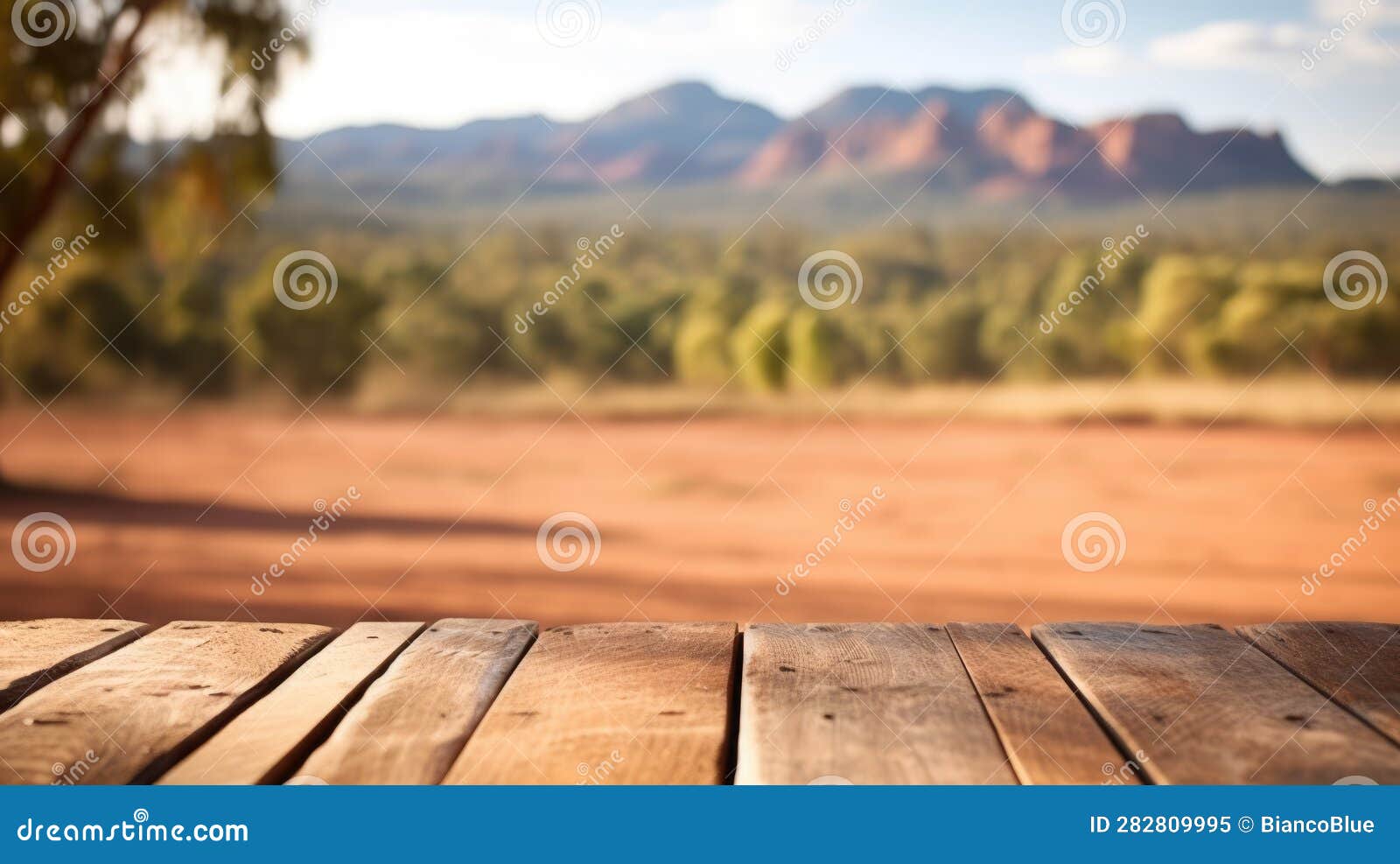 the empty wooden table top with blur background of australian outback. exuberant.