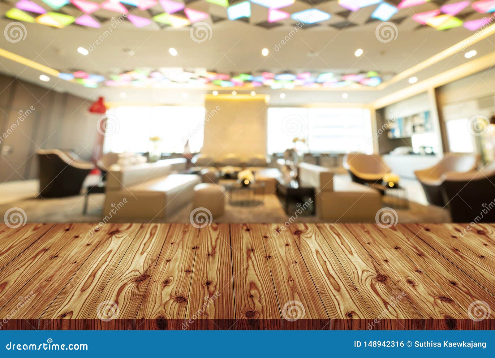 empty wooden table top with blurred of coffee shop, cafe, bar background, abstract background can be used for display or montage