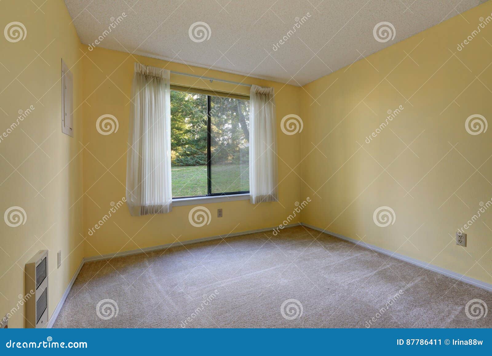 Empty Yellow Room With Wall To Wall Carpet Floor Stock Image