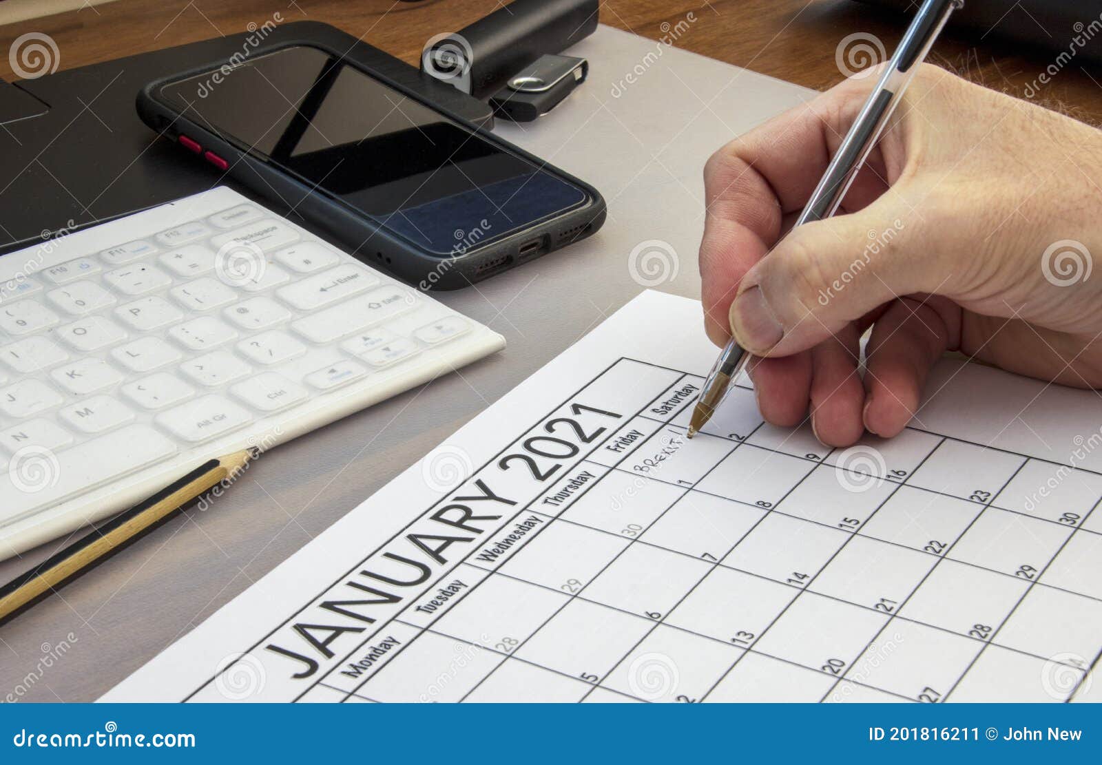 end of the brexit transition period being written onto january 2021 calendar page. high quality photo