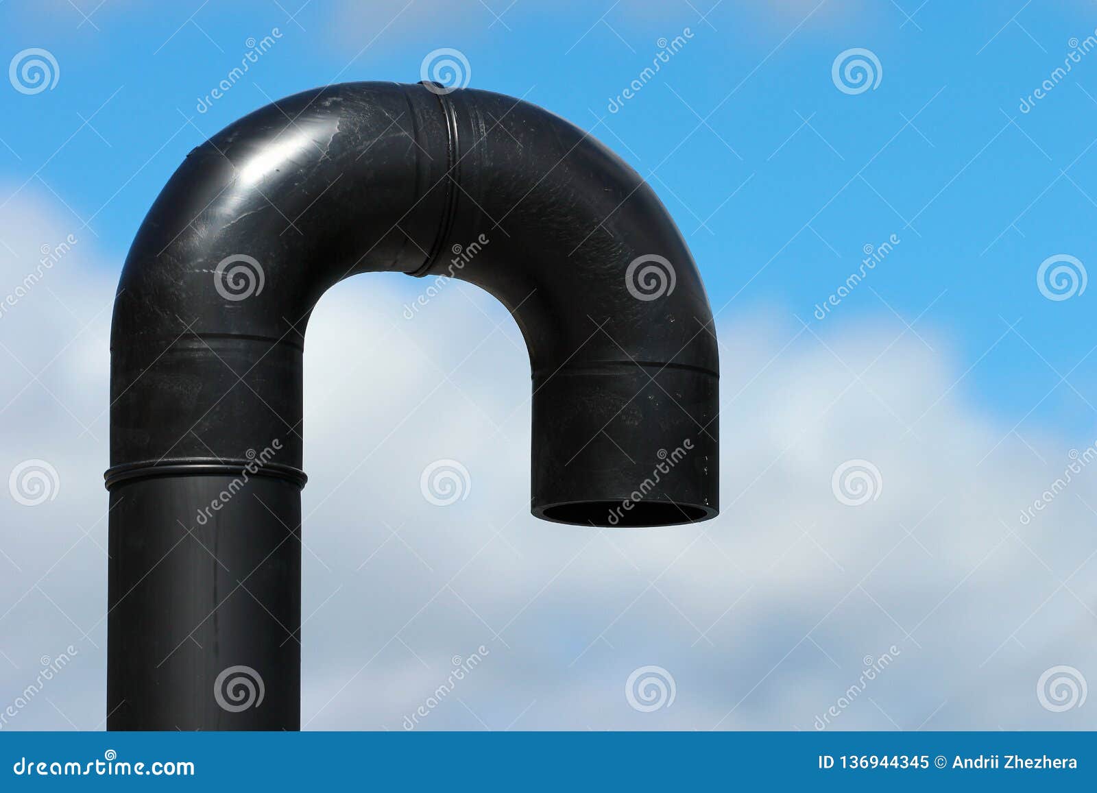 End of Industrial Shower, Uturn of Black Plastic Pipe on Blue Sky