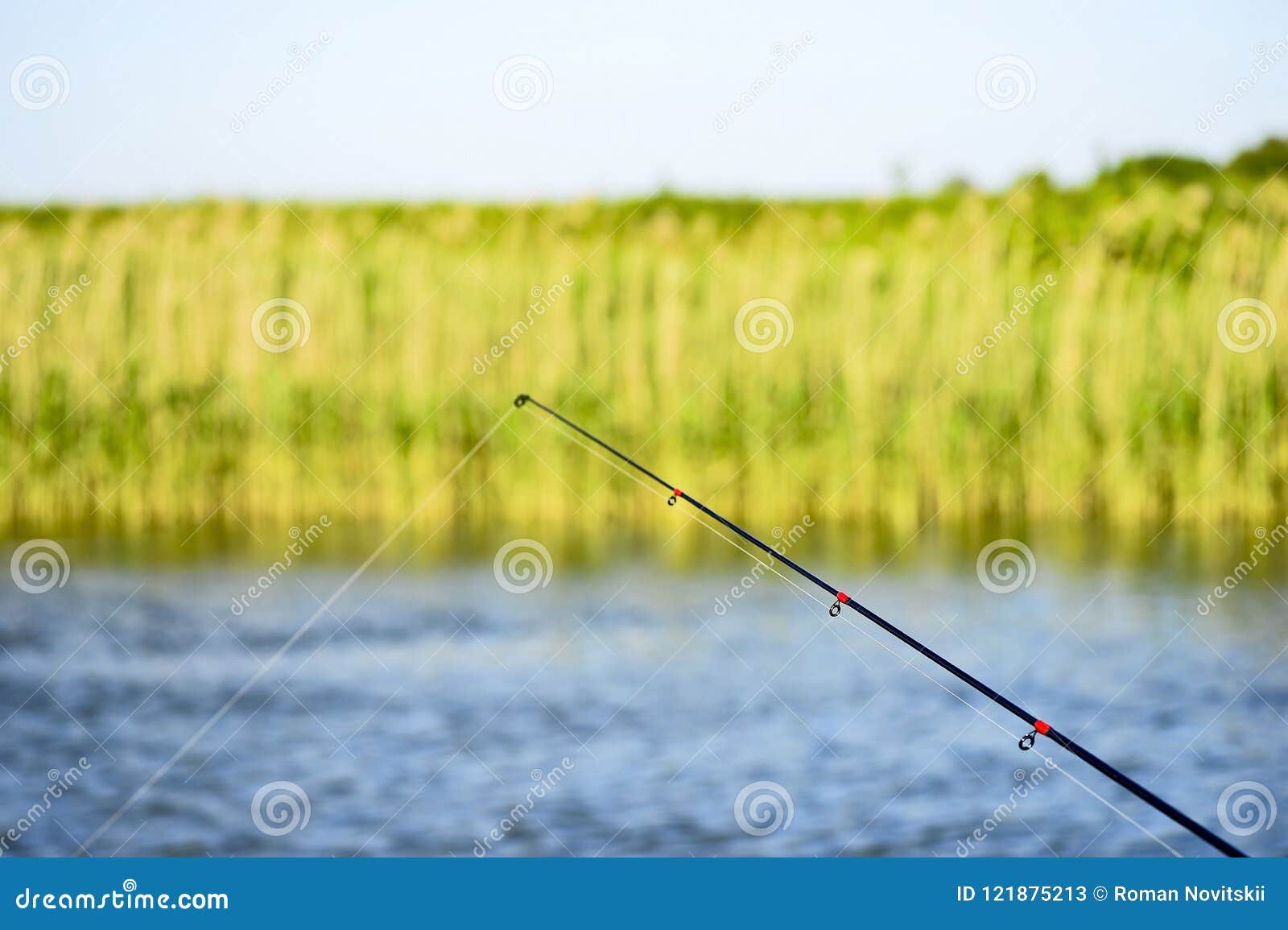 The End of the Spinning Rod on the Background of Water with a Fishing Line.  the Concept of Minimalism Stock Image - Image of hobby, casting: 121875213