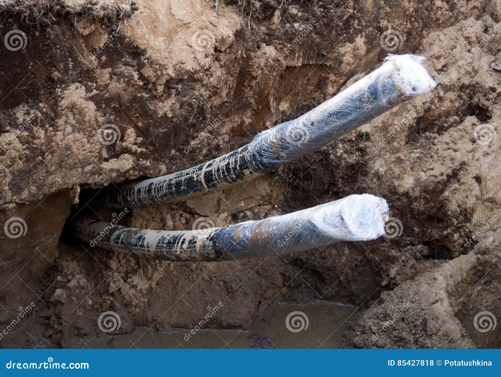 Cable Sticking Out Of Cement Dirty Floor Background Wiring Repair