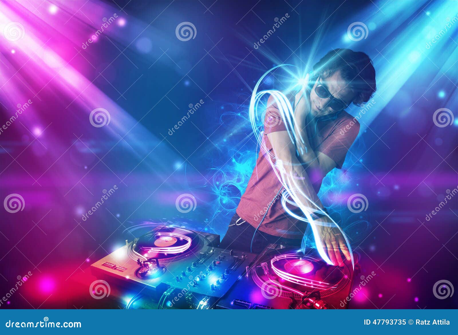Energetic Dj Mixing Music with Powerful Light Effects Stock