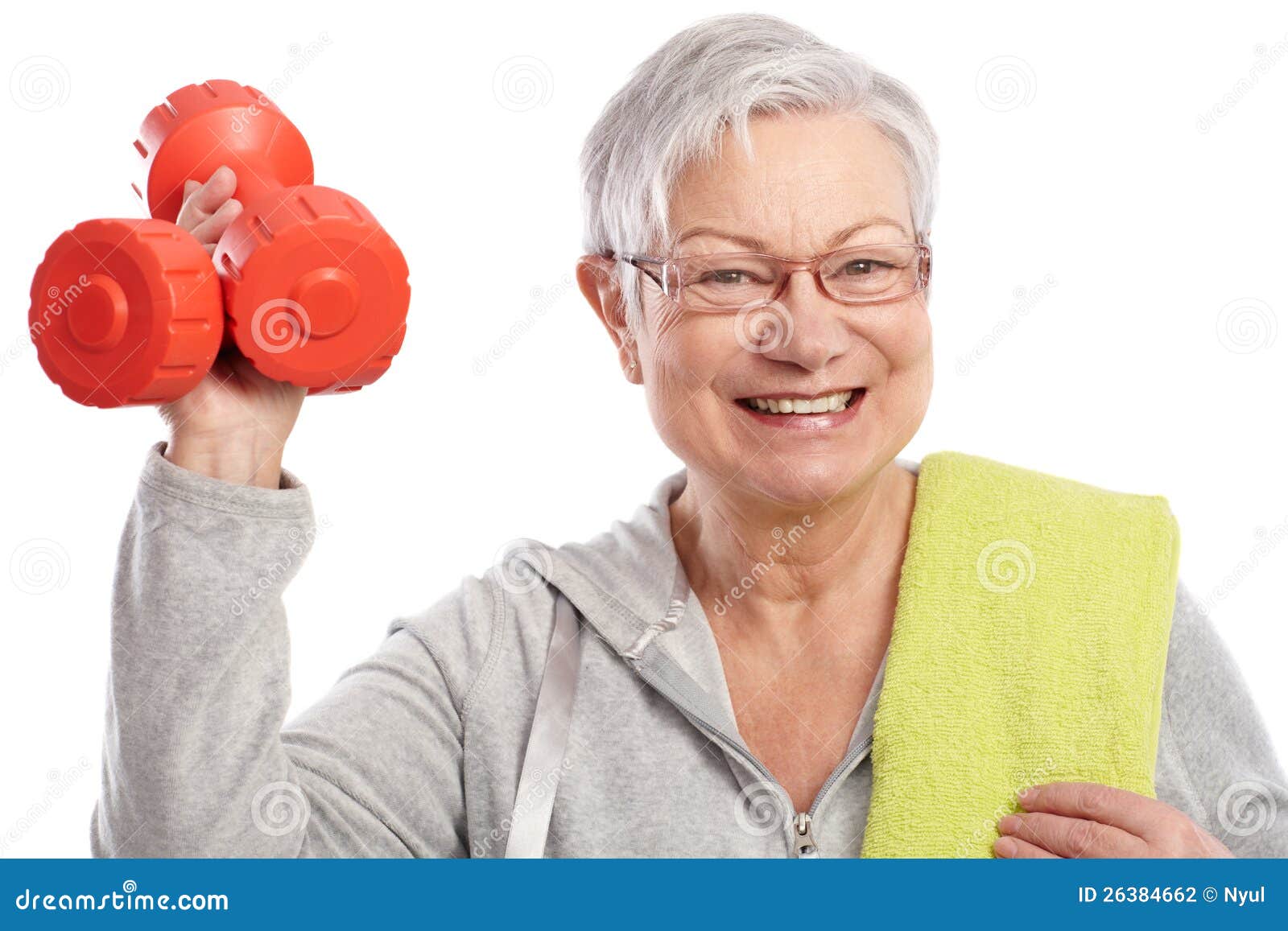 energetic elderly woman with dumbbells smiling
