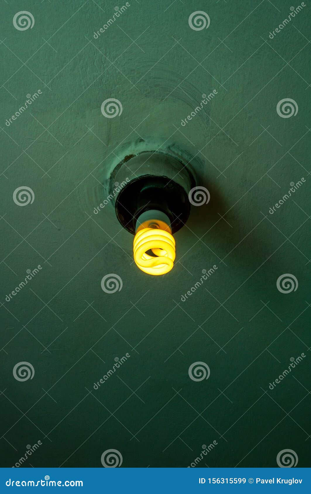 Energy Efficient Fluorescent Lamp on a Green Ceiling Stock Image