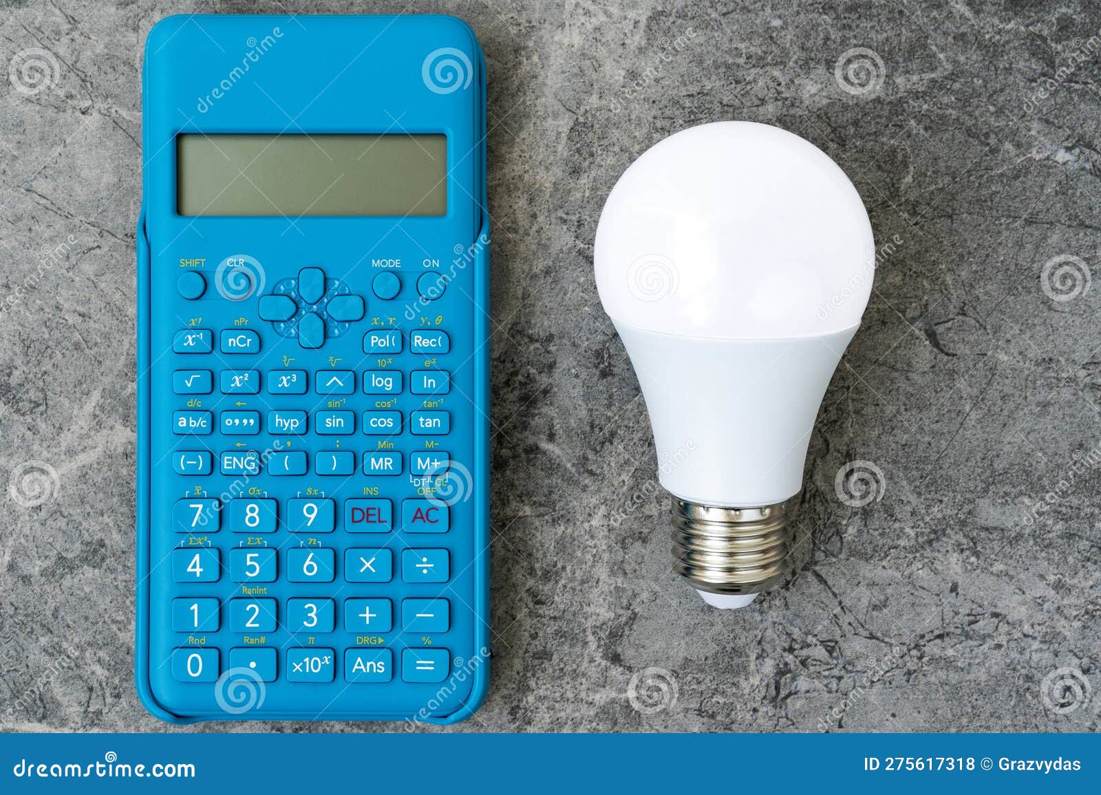 Energy Efficient Light Bulb and Blue Modern Calculator Stock Photo