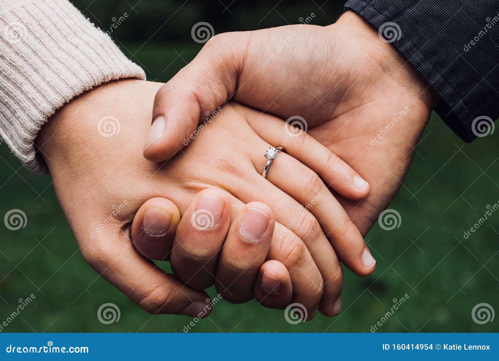 an engaged couple with engagement ring