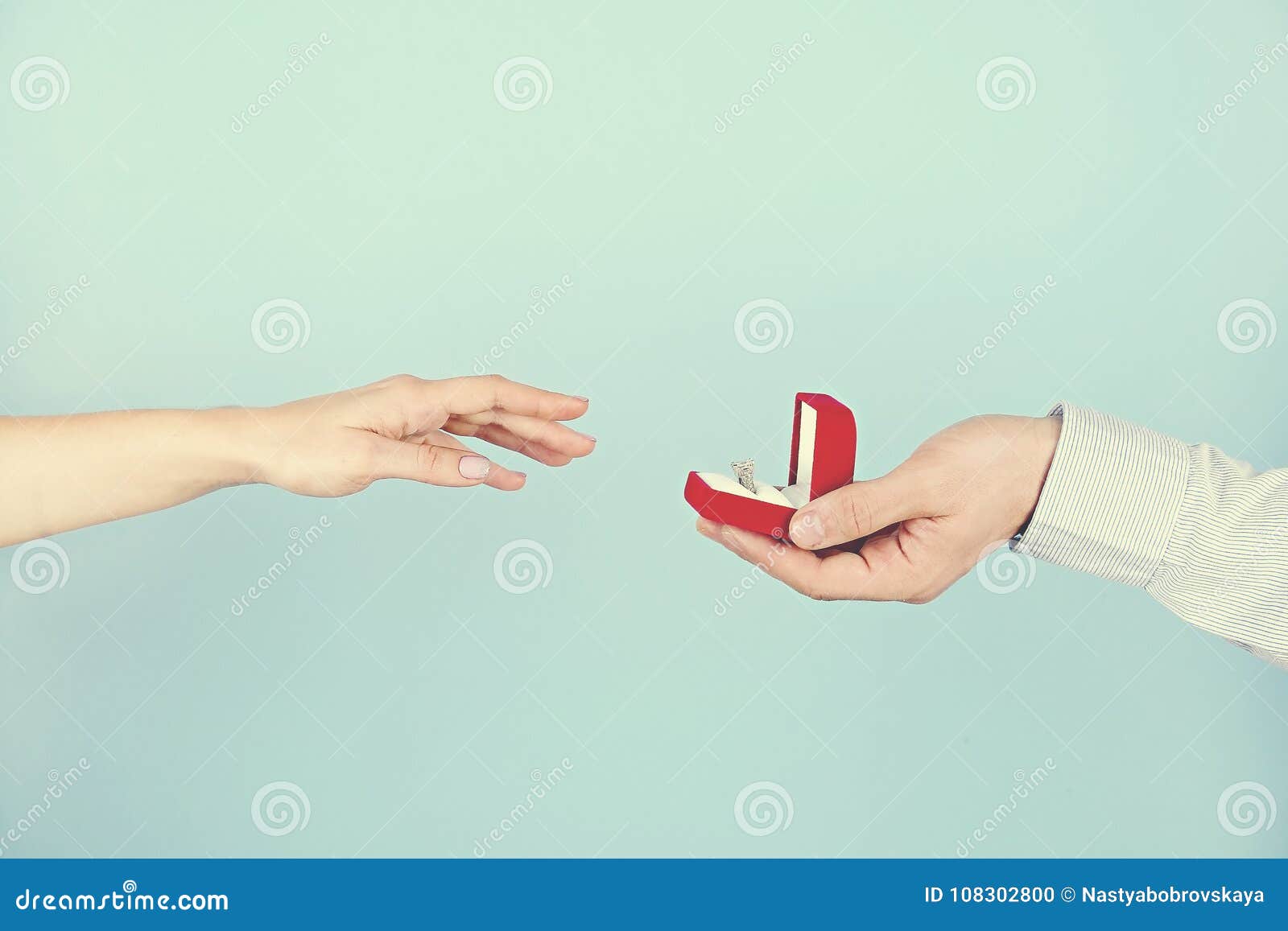 Engagement / Marriage / Wedding Proposal Scene. Close Up of Man Handing
