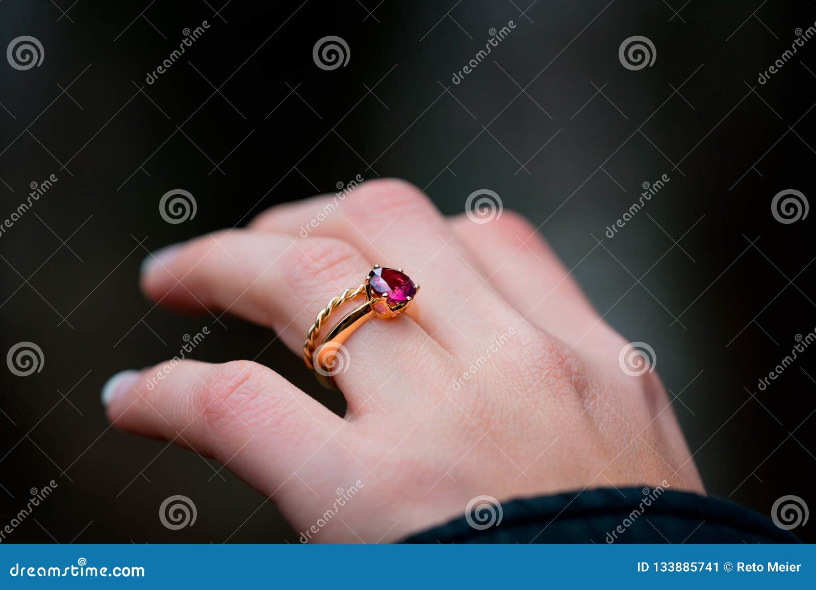 two lovers, a couple, a boy and a girl are holding hands. The girl on her  hand is a wedding ring. the concept of love 4951156 Stock Photo at Vecteezy
