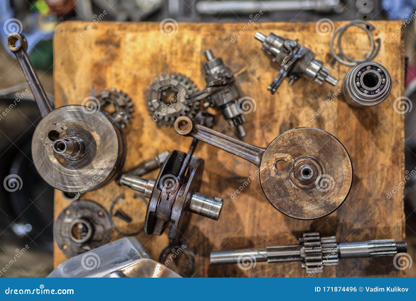 Engine Parts of an Old Motorcycle are Spread Out on the Table Stock