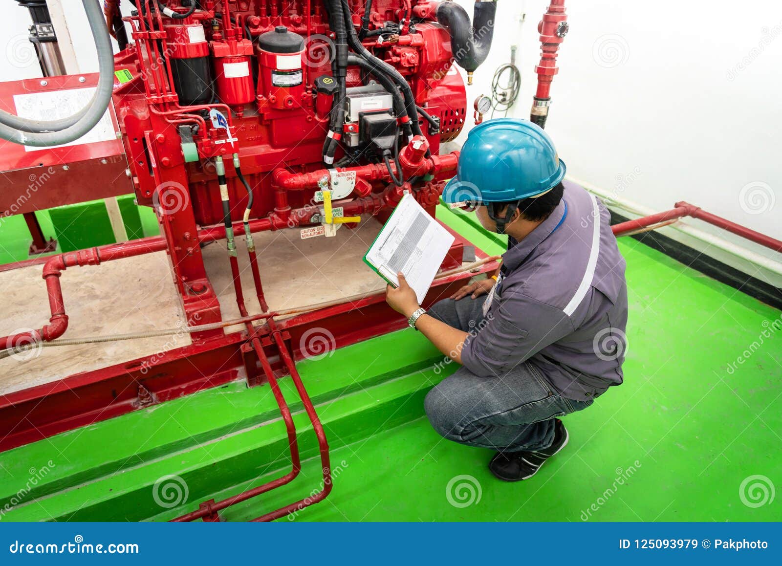 Engineer Checking Industrial Generator Fire Control System Editorial