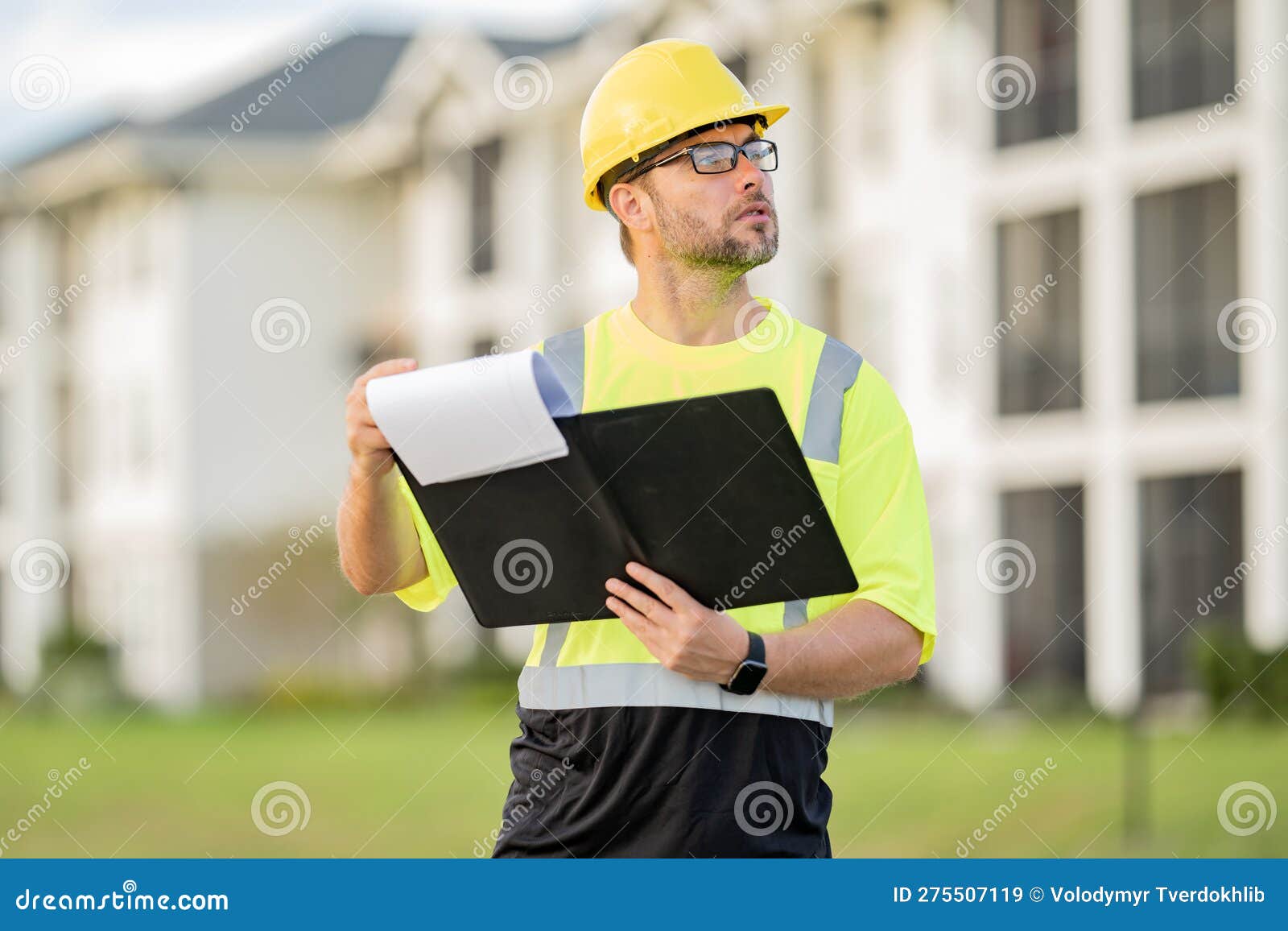 Engineer with Clipboard, Building Inspection. Builder on Site