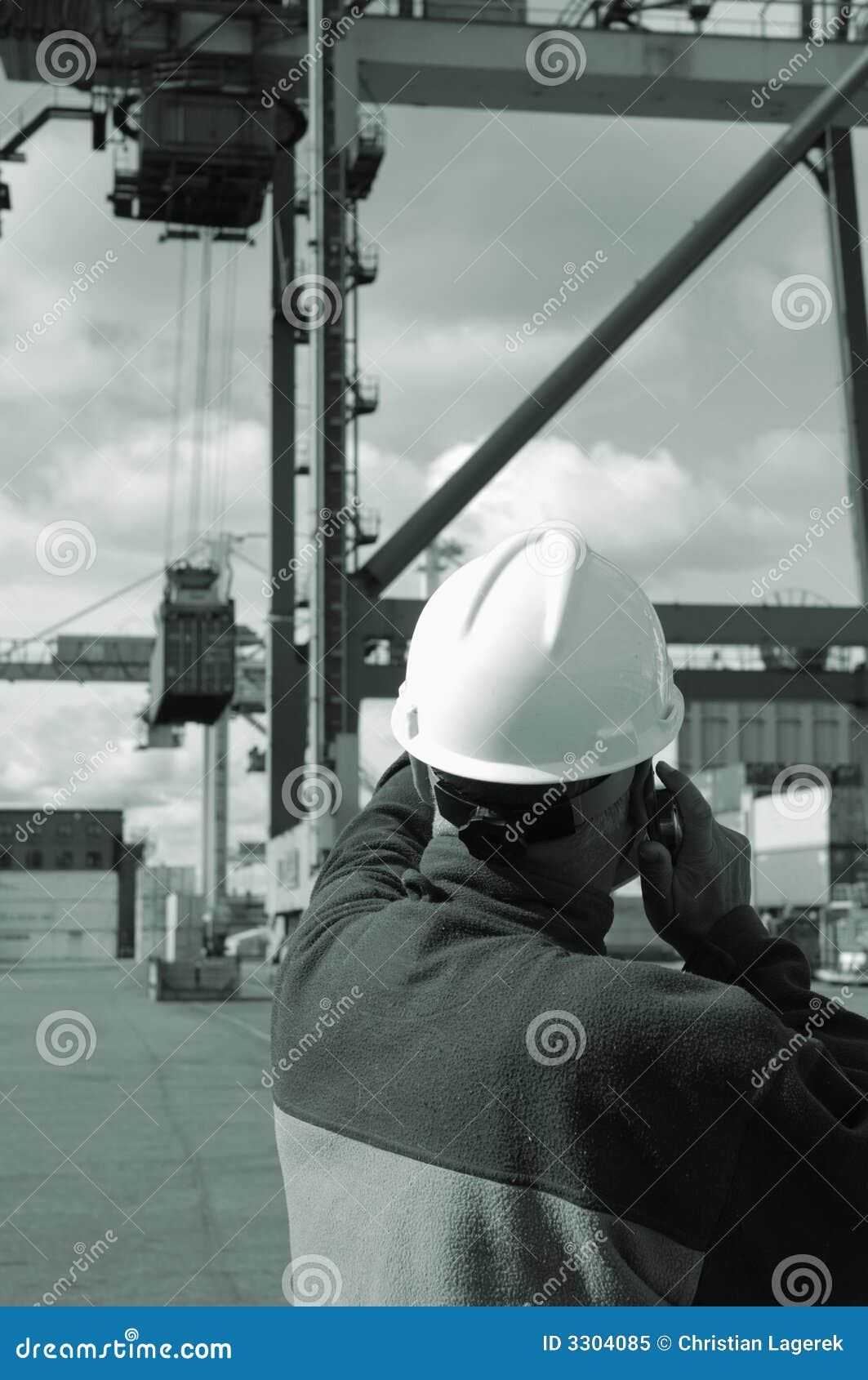 engineer directing crane