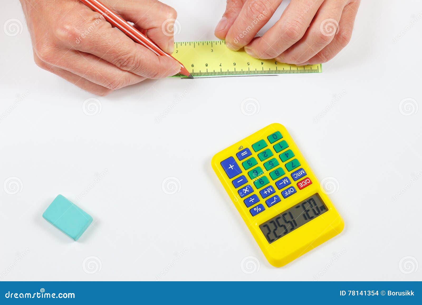 Engineer Hands at Work with a Pencil, Digital Calculator and Ruler