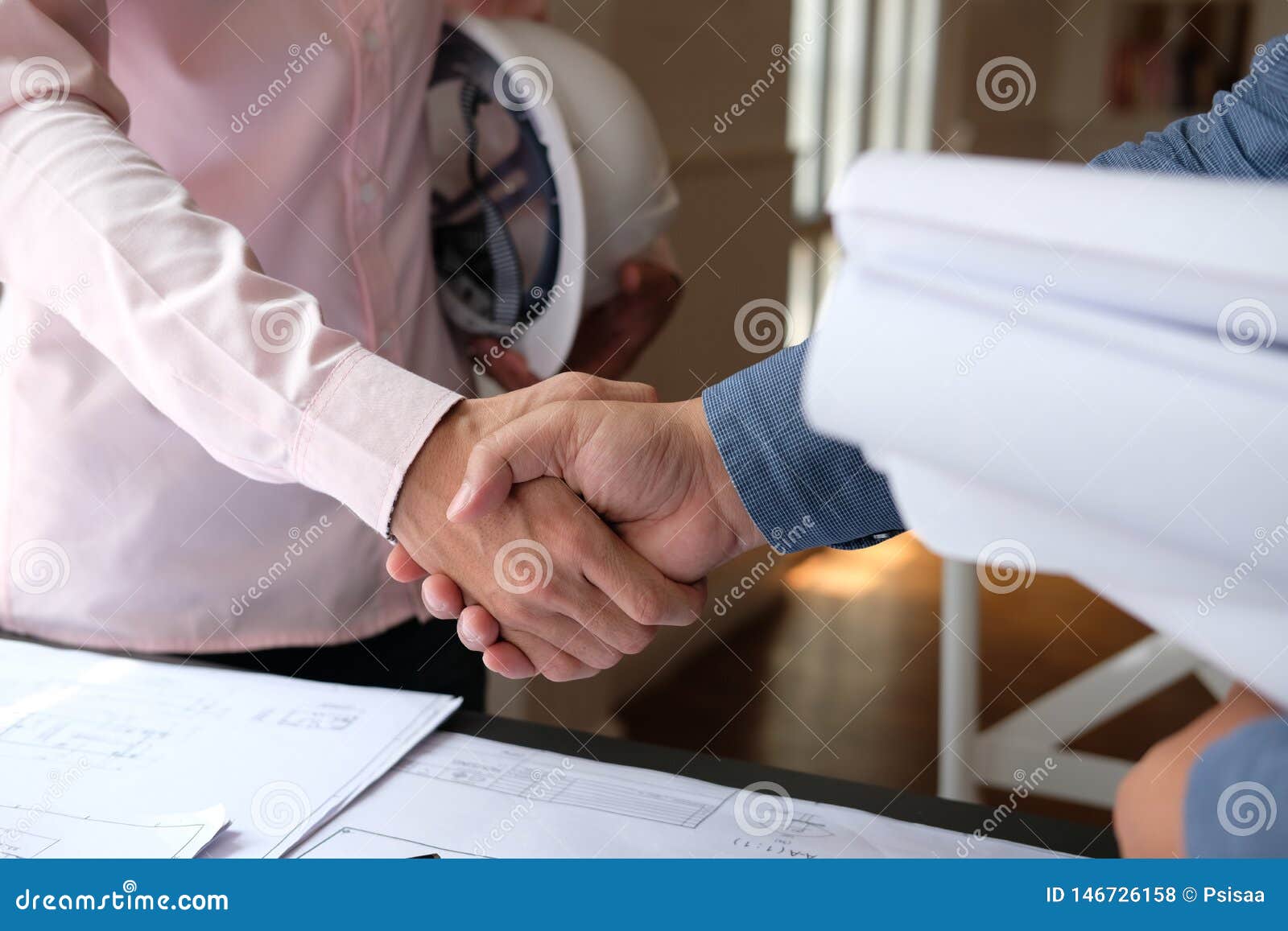 Engineer Handshaking. Architect Shaking Hands for Building Construction
