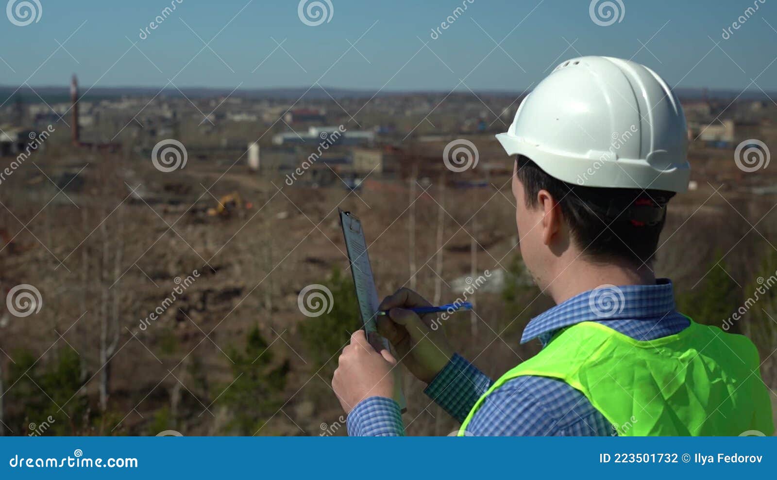 Engineer Inspector Inspects the Territory for the Future Plant. Stock