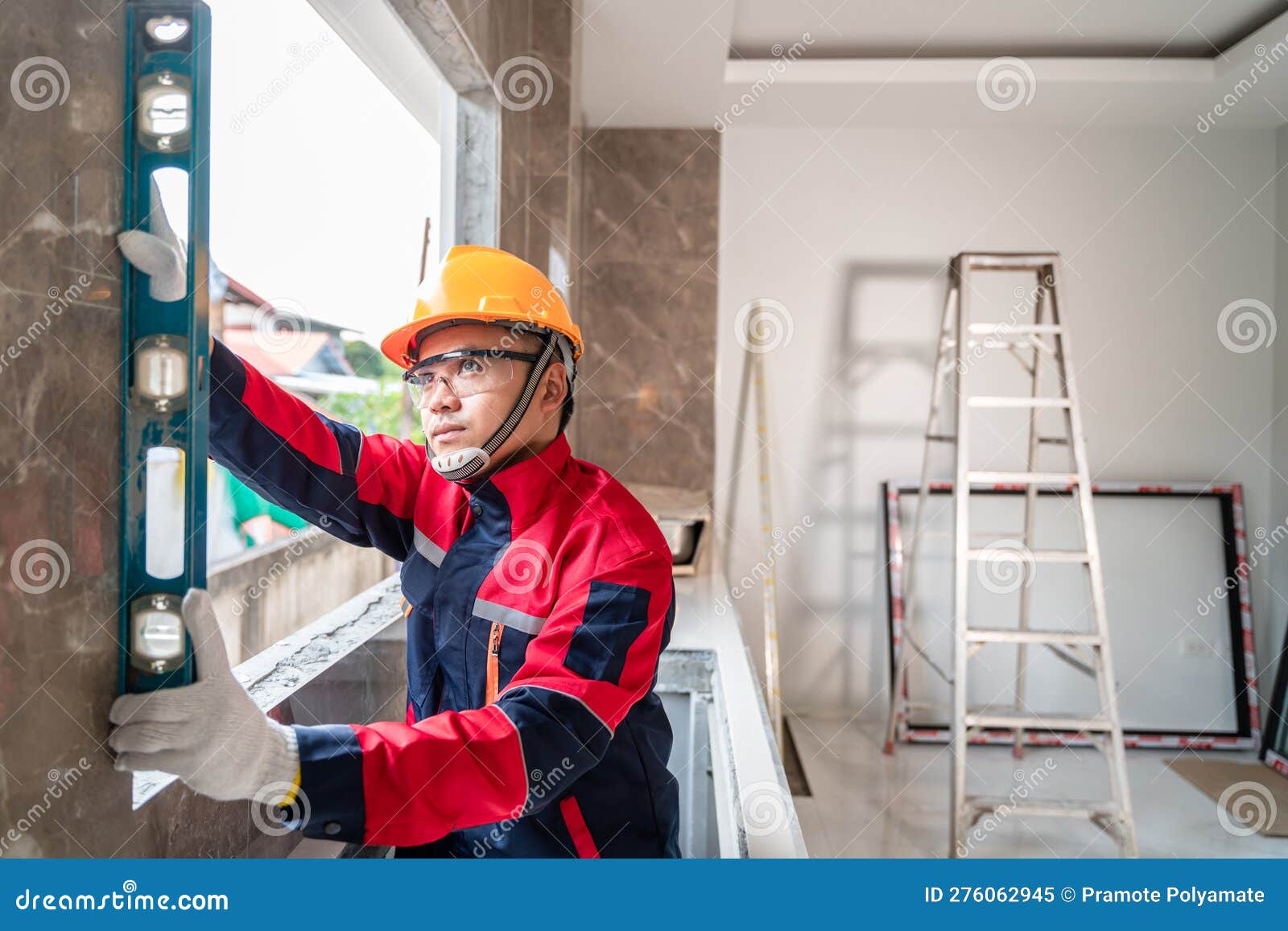 An Engineer or Inspector is Using a Water Level To Professionally