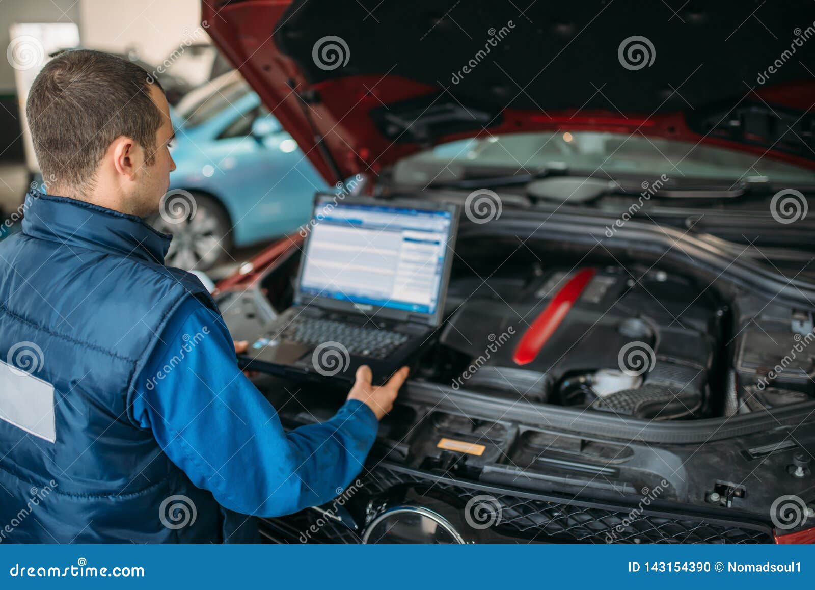 Engineer Makes Computer Diagnostics of Car Engine Stock Photo Image