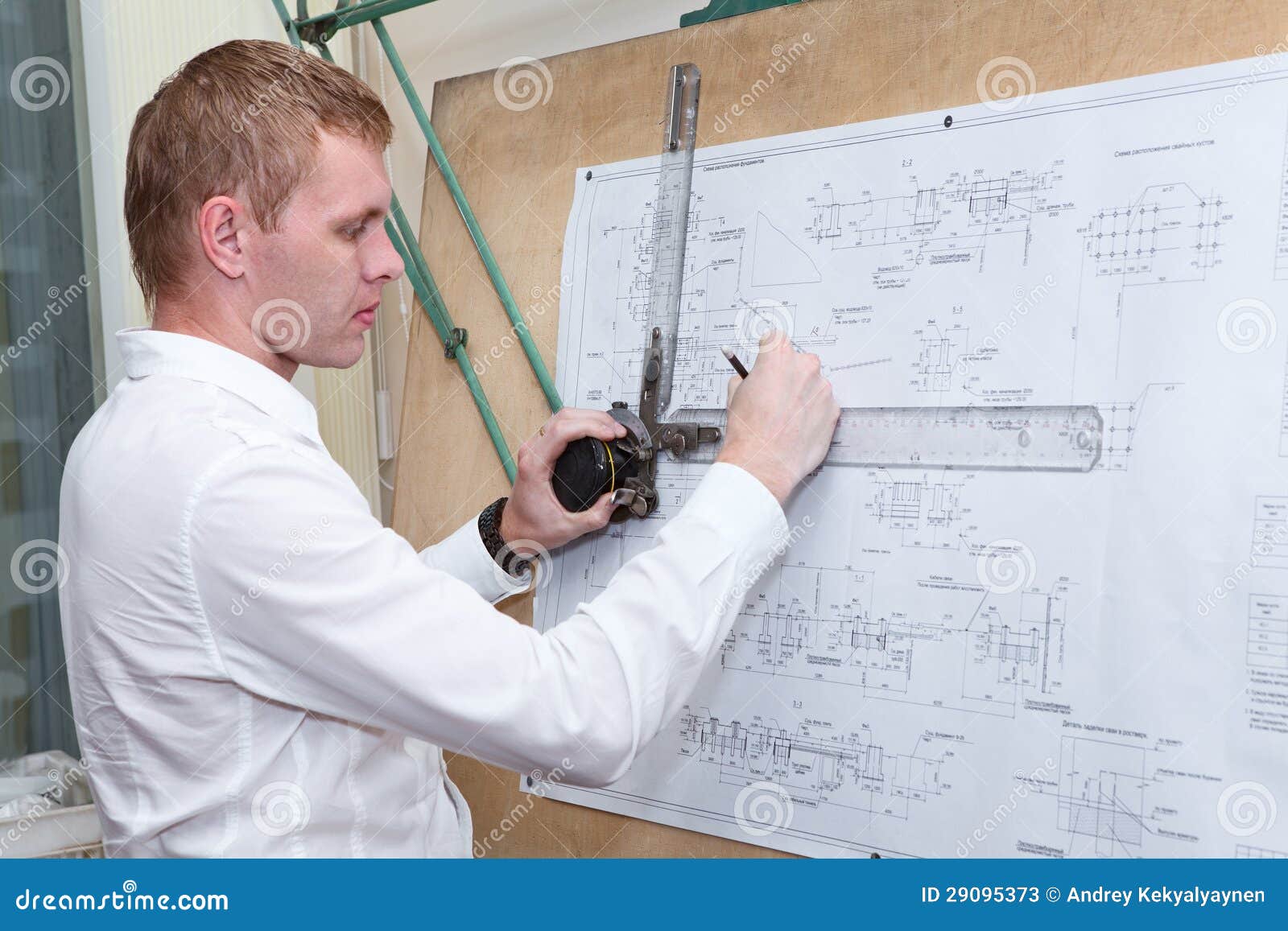 Engineer Making A Blueprint Project With Drawing Board Stock Photos 