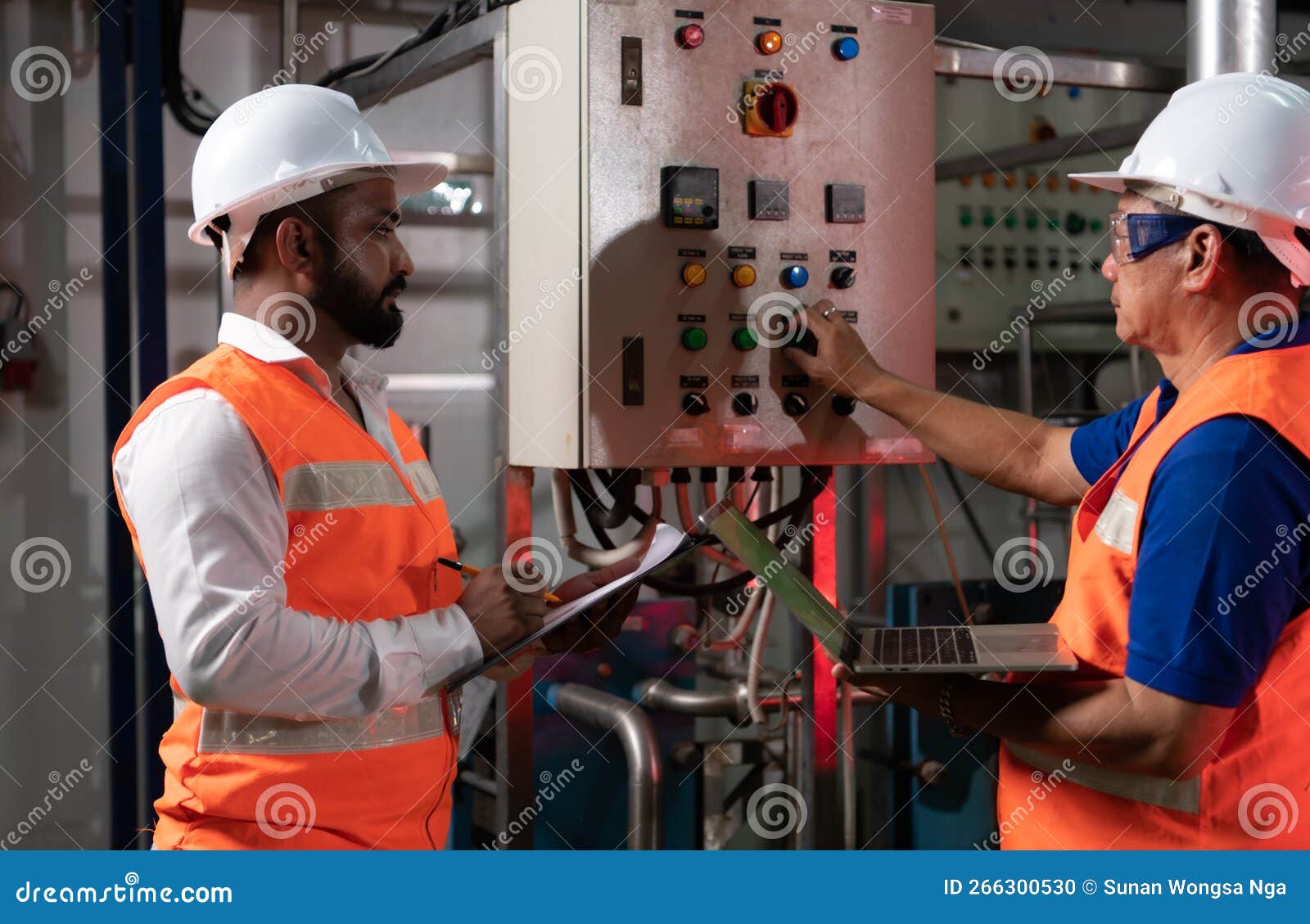 Engineer of a Mechanical Plant Inspecting and Explaining the
