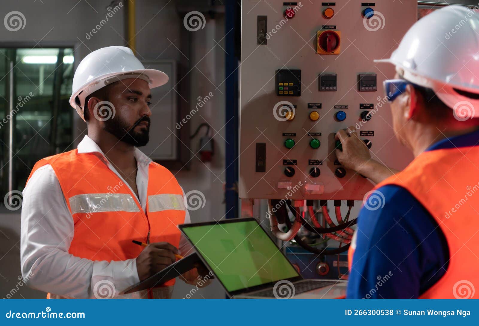 Engineer of a Mechanical Plant Inspecting and Explaining the
