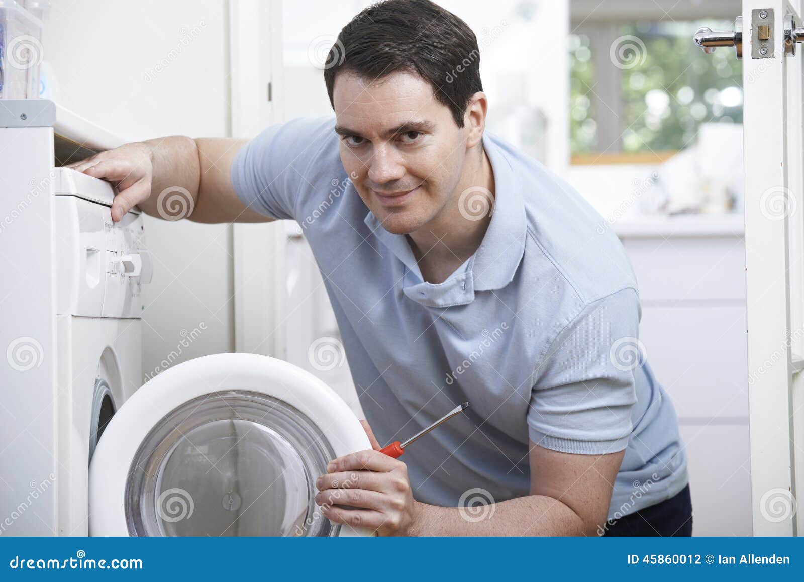 engineer mending domestic washing machine
