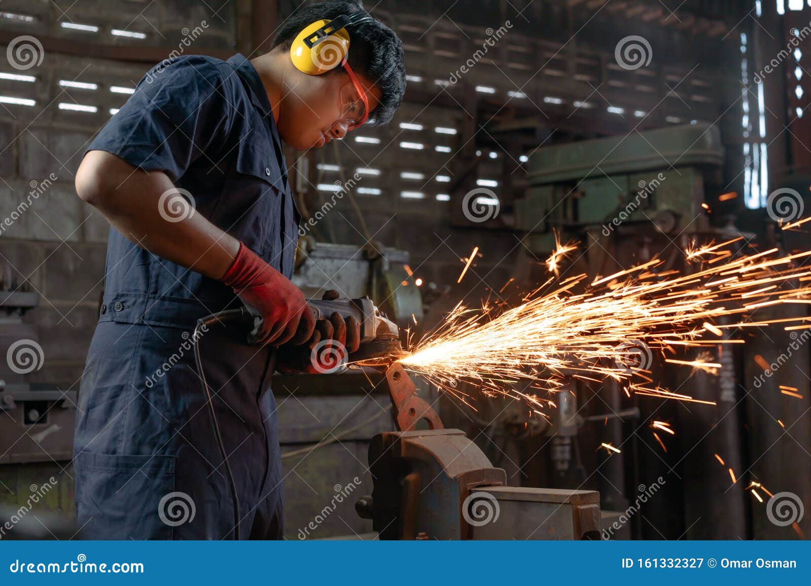 engineer operating angle grinder hand tools in manufacturing factory - mechanical engineering student using power tool with hot
