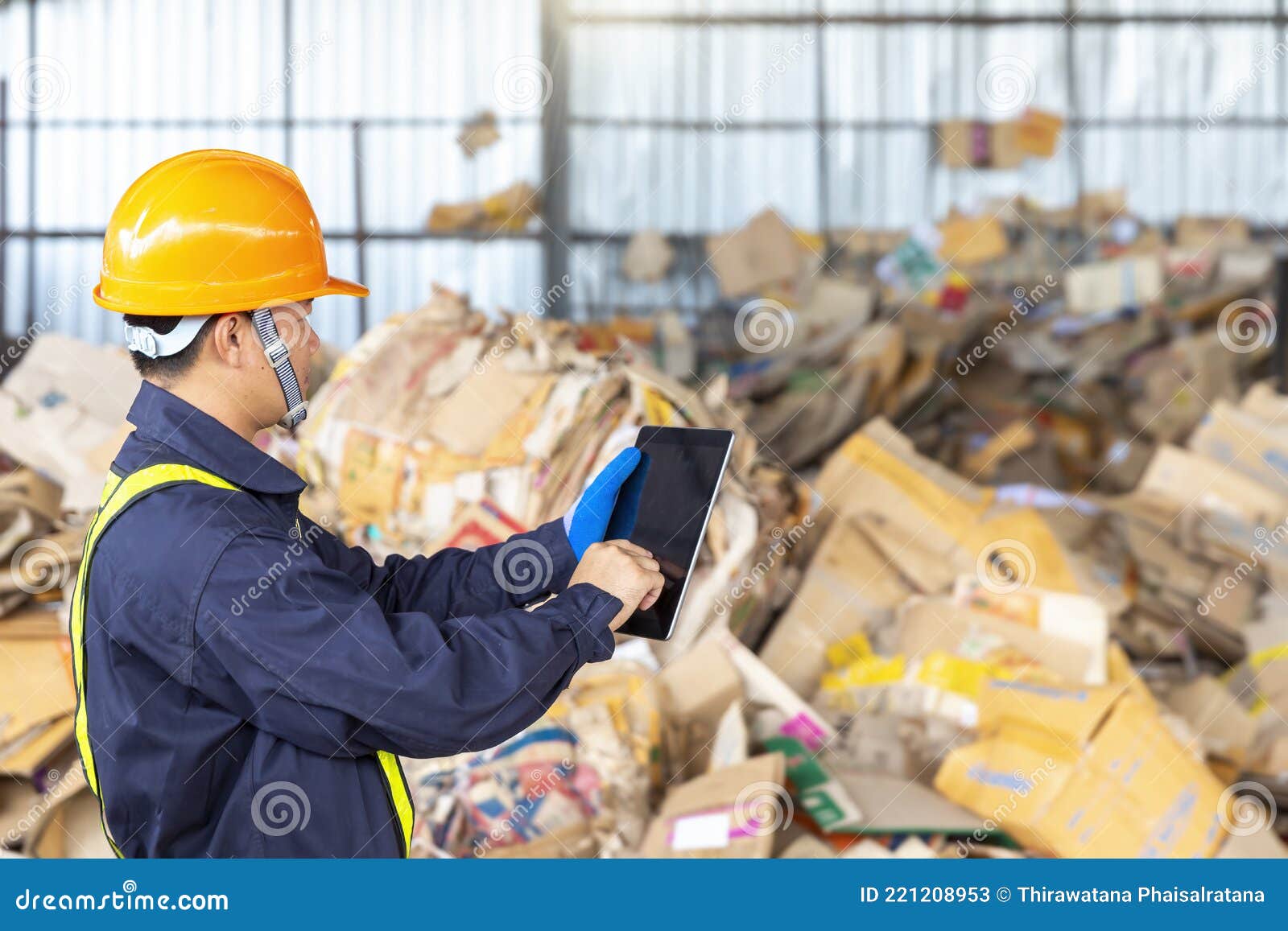 Engineer in a Paper Recycling Plant. Employees in a Paper Recycling
