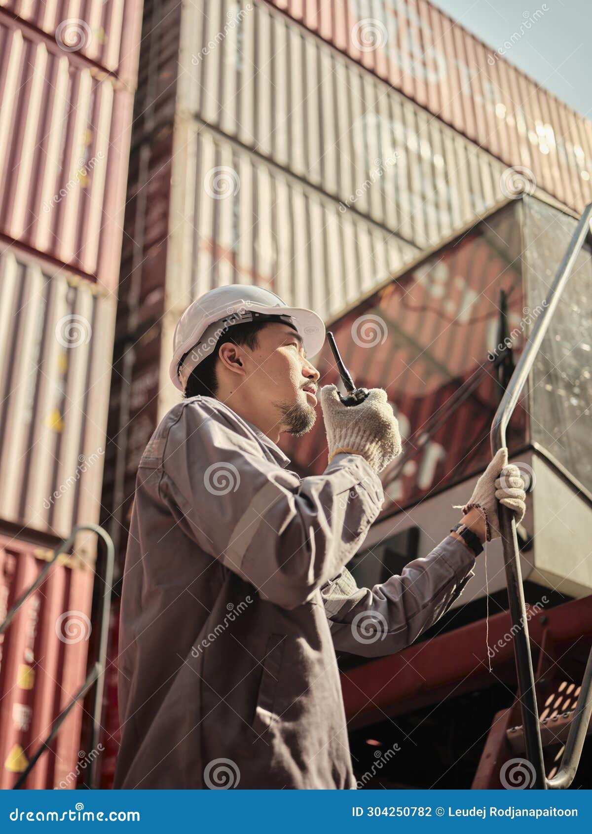 Engineer is Pointing Controlling the Job at the Container Cargo Stock