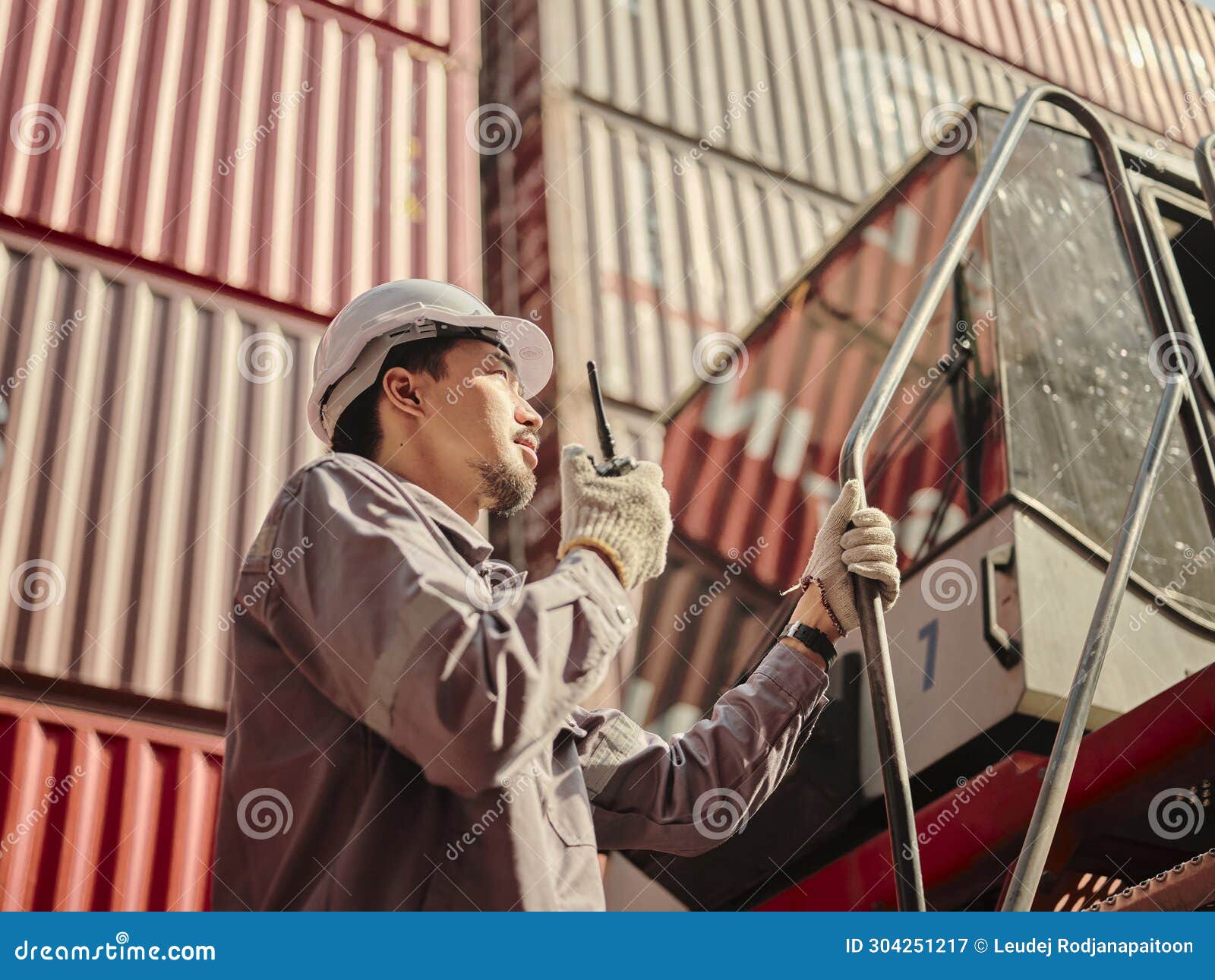 Engineer is Pointing Controlling the Job at the Container Cargo Stock