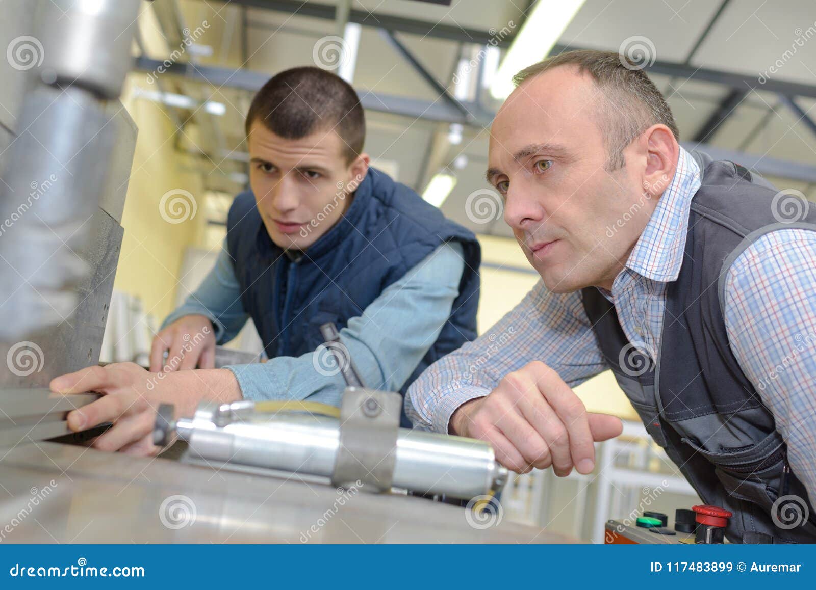 Engineer Showing Apprentice How To Use Tool in Factory Stock Image Image of male, horizontal Engineer Showing Apprentice How To Use Tool in Factory Stock Image Image of male, horizontal